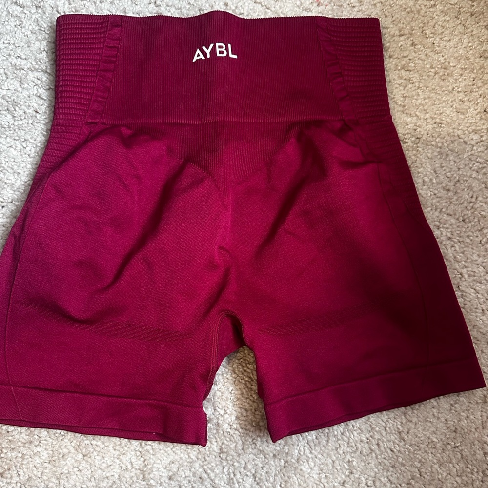 AYBL workout shorts. Size M. only worn a few times. deep red color.
